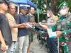 Bhabinkamtibmas Desa Ciantra Bagikan Masker kepada Warga, Polisi Ajak Masyarakat Aktif Jaga Keamanan